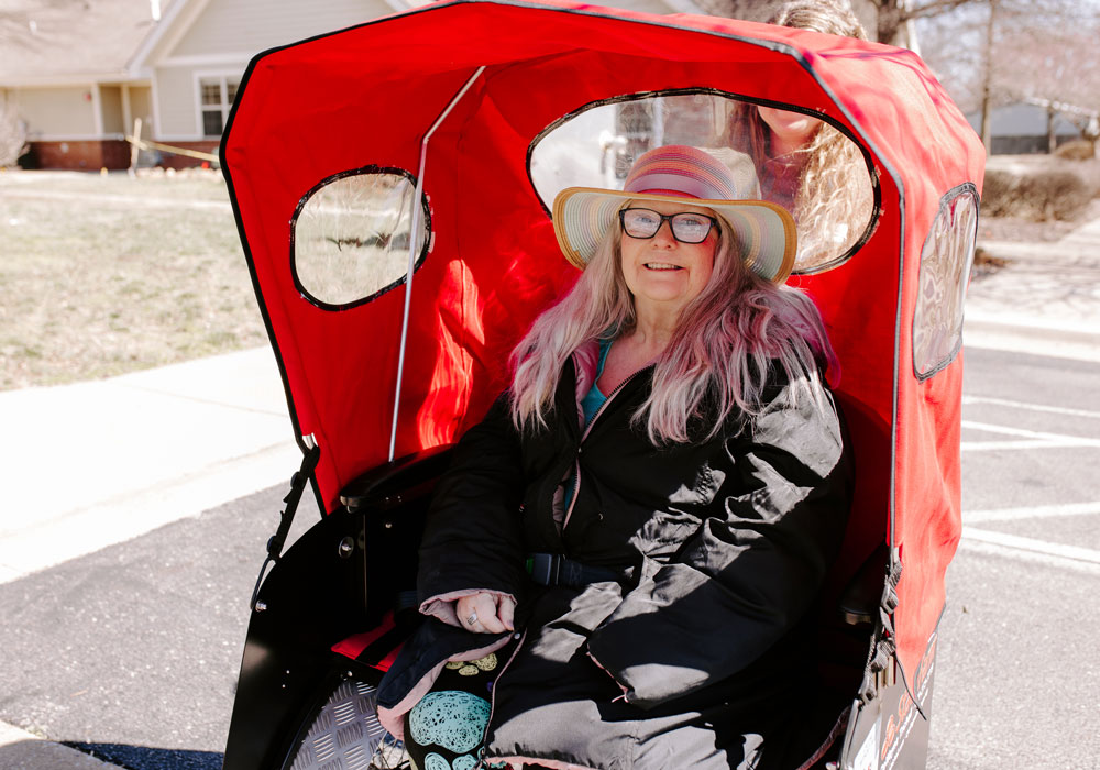 Elder Riding in Pedicab Green House Cottages of Northwest Arkansas